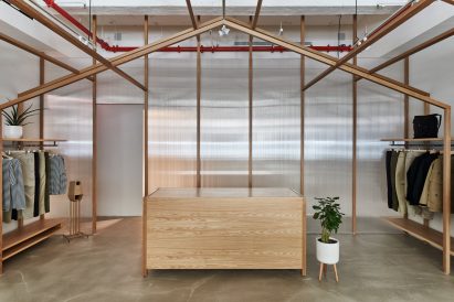 Corrugated plastic walls in Nanamica store by Taichi Kuma