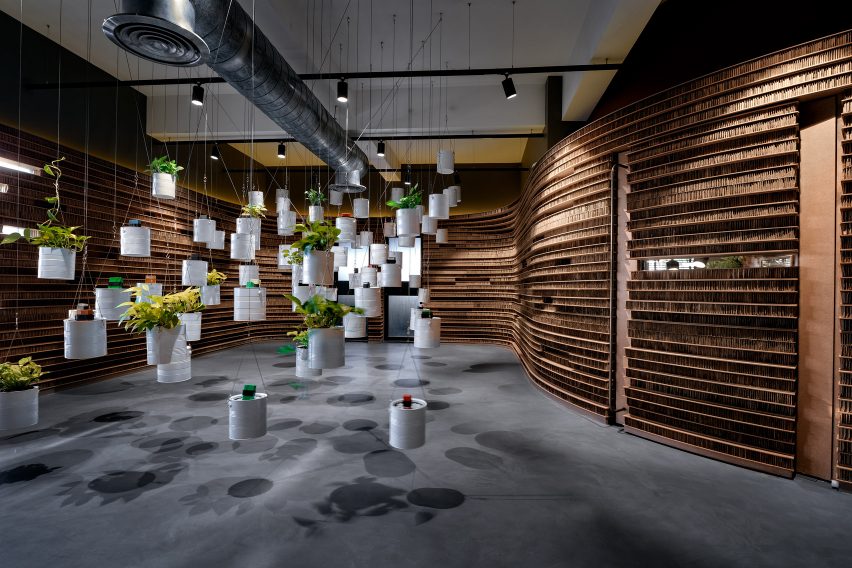 Planters made out of paint tins in Walls of of Office in Cardboard by Studio VDGA in Pune, India