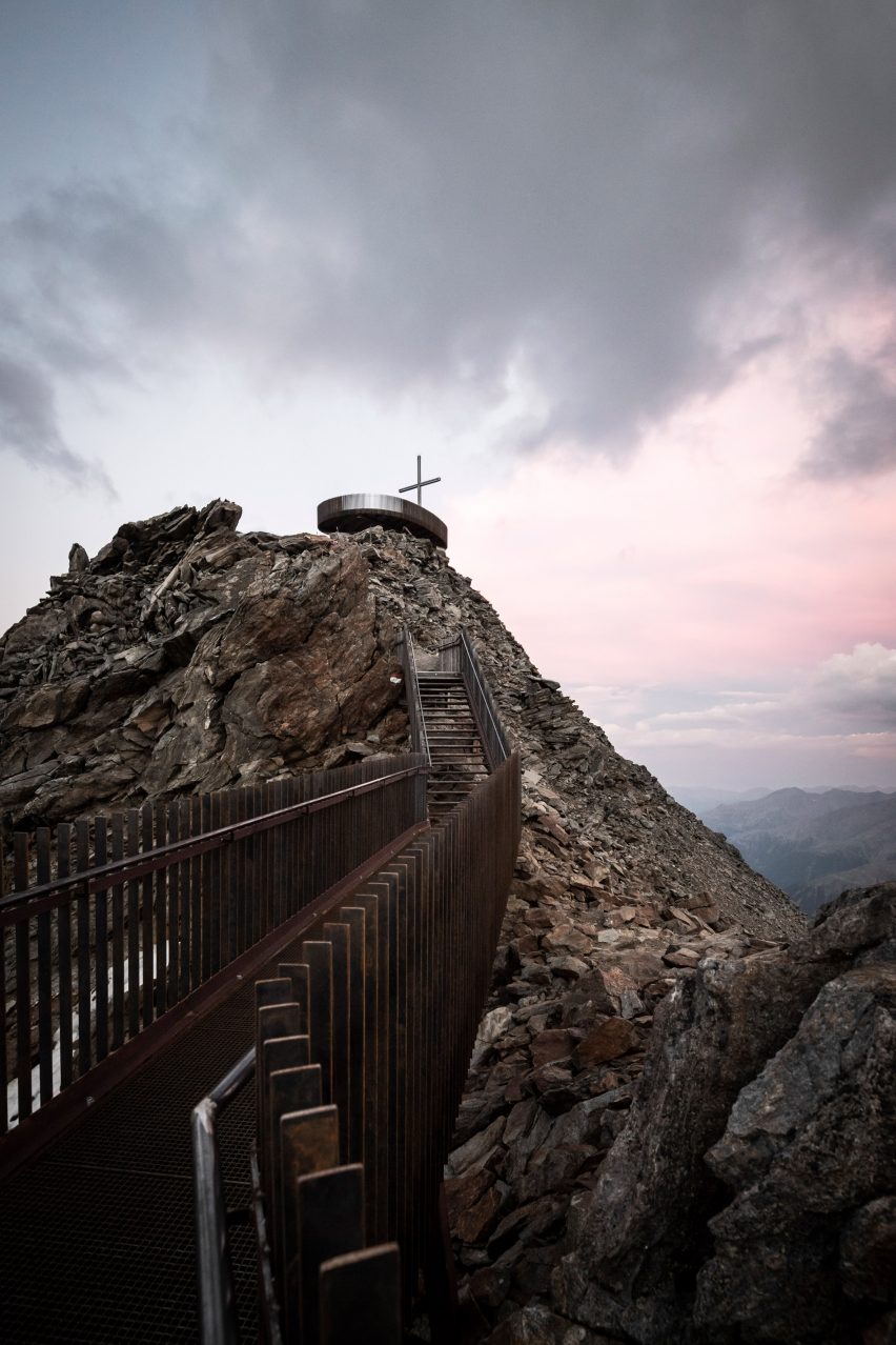 Viewing platform overlooks glacier on top of mountain ridge in South Tyrol