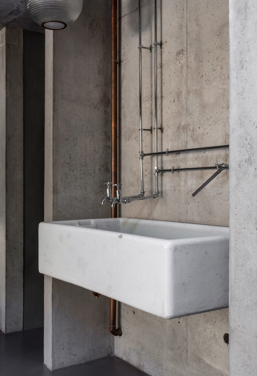 Kitchen sink and metal taps in Untiled House extension by Szczepaniak Astridge in London