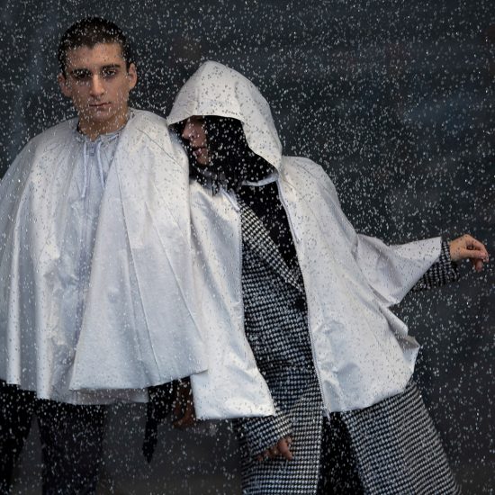 Urbanella is a rainproof cape that packs away into a handy bag