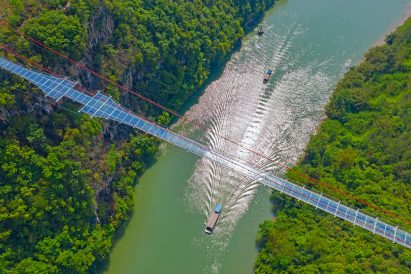World's longest glass-bottomed bridge in Huangchuan Three Gorges Scenic Area in southern China