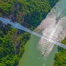World's longest glass-bottomed bridge in Huangchuan Three Gorges Scenic Area in southern China