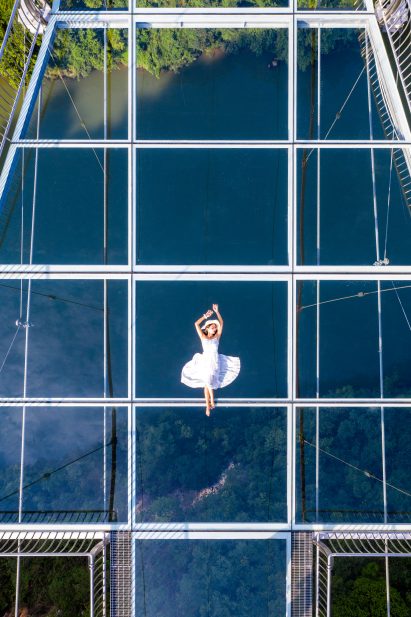 World's longest glass-bottomed bridge in Huangchuan Three Gorges Scenic Area in southern China