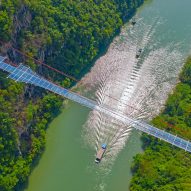 World's longest glass-bottomed bridge in Huangchuan Three Gorges Scenic Area in southern China