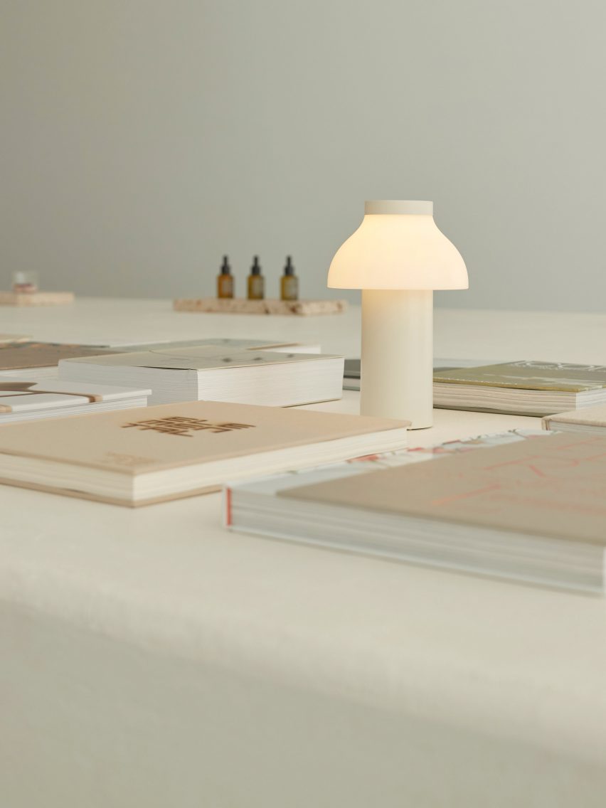 Books cover the central island of Adytum Library designed by Pattern
