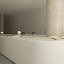 Adytum Library designed by Pattern features a huge plaster island