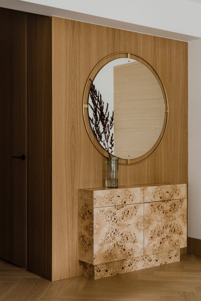 Botaniczna Apartment by Agnieszka Owsiany Studio includes burl wood furniture