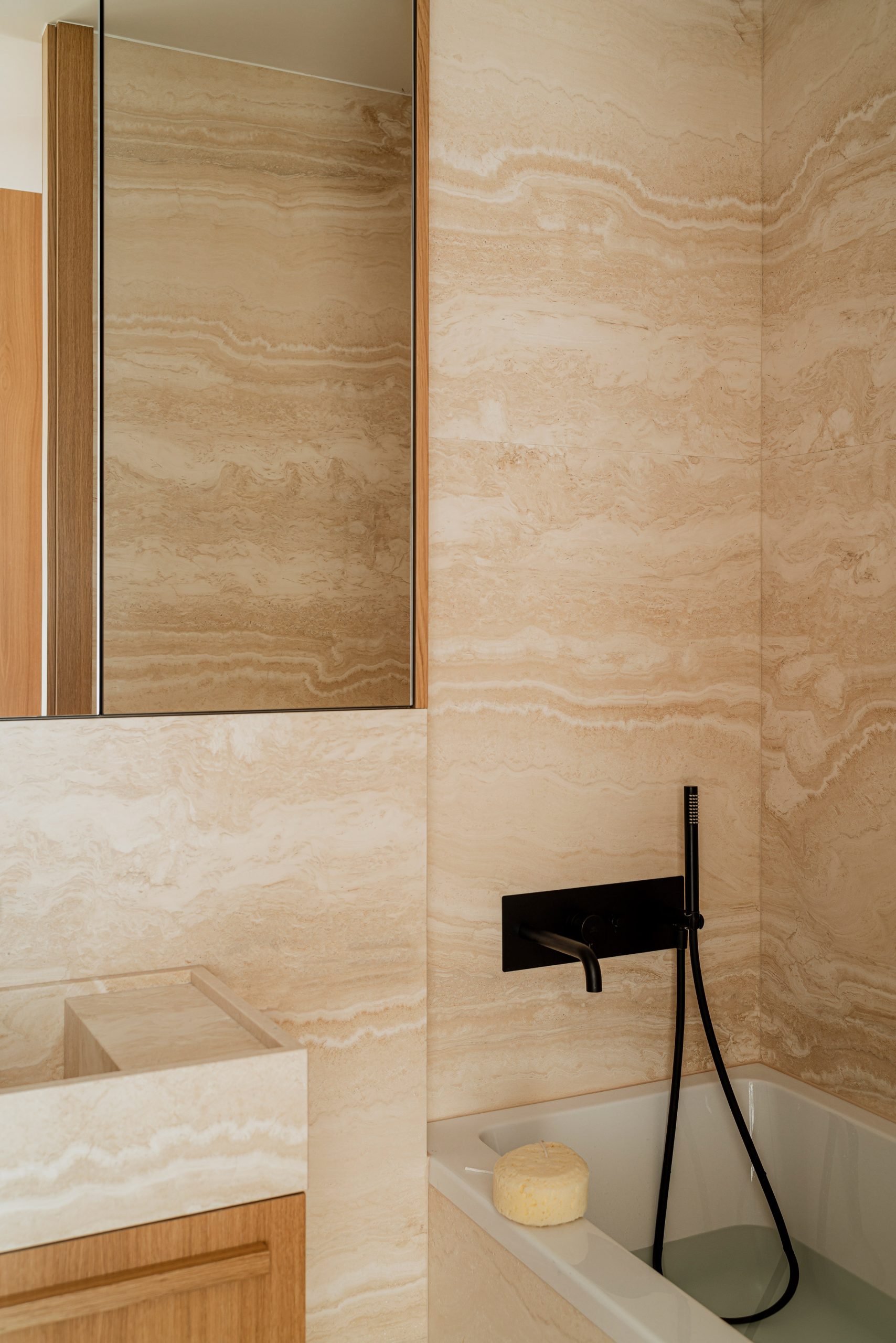 Travertine bathroom in Botaniczna Apartment, Poland, by Agnieszka Owsiany Studio