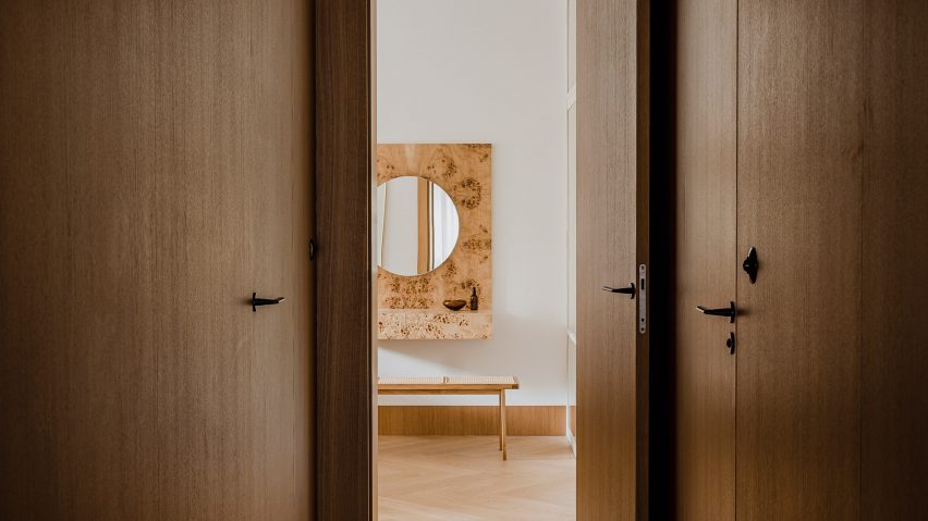 Botaniczna Apartment by Agnieszka Owsiany Studio includes burl wood furniture