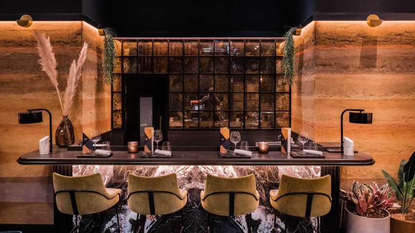 Bar with Rammed Earth Finishes clay plaster walls by Clayworks