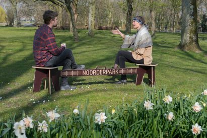 People sitting on Corona Crisis Kruk, a social distancing bench by Object Studio