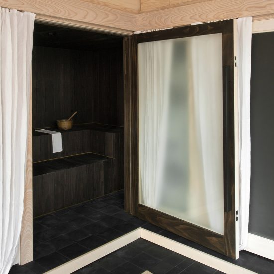 Dark bathroom inside Pioneer Square Loft, USA, by Plum Design and Corey Kingston