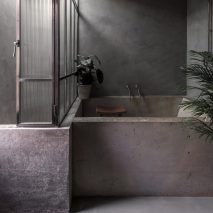 Dark bathroom inside Bathroom of Untitled House, UK, by Szczepaniak Astridge