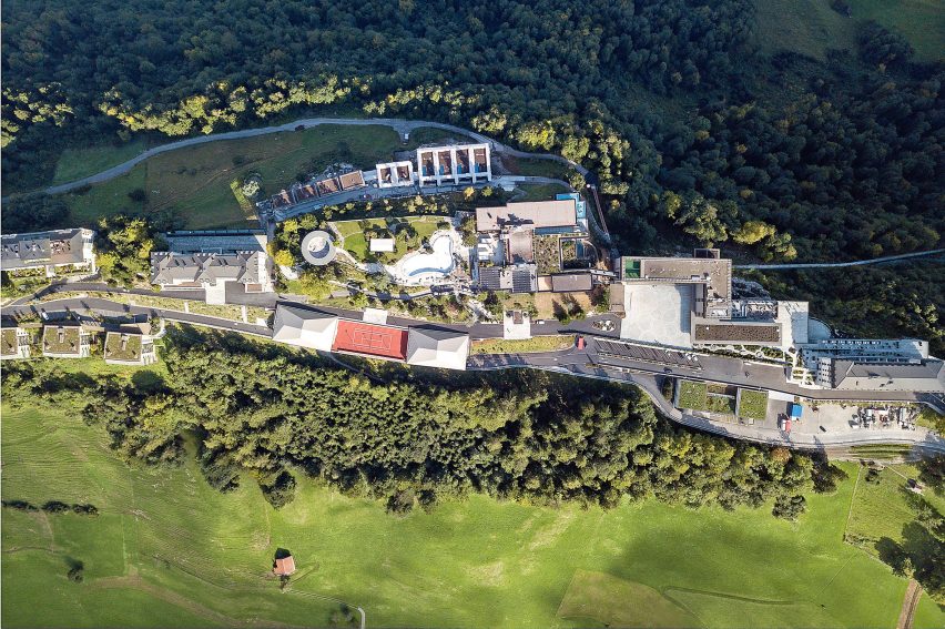 Aerial view of Diamond Domes tennis courts designed by Rüssli Architekten with CLT roofs by Neue Holzbau in the Swiss Alps