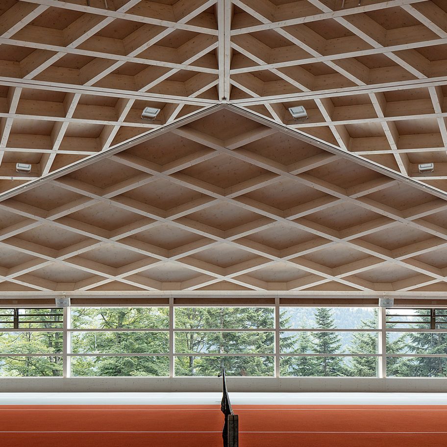View from Diamond Domes tennis courts designed by Rüssli Architekten with CLT roofs by Neue Holzbau in the Swiss Alps