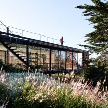 Slatted wood encloses glass Engawa House in Chile