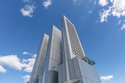 Three ornamental steel and glass fins