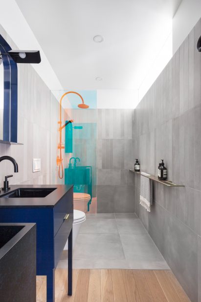Bathroom with colour-changing shower screens.