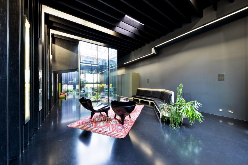 Concrete bench in living room of Lost House by David Adjaye