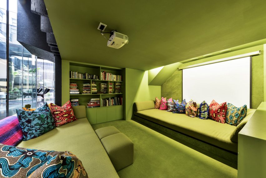 Green sunken cinema room of Lost House by David Adjaye