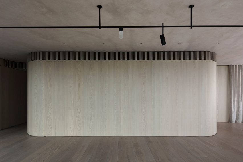 The Melburnian Apartment by Edition Office features oak storage volumes