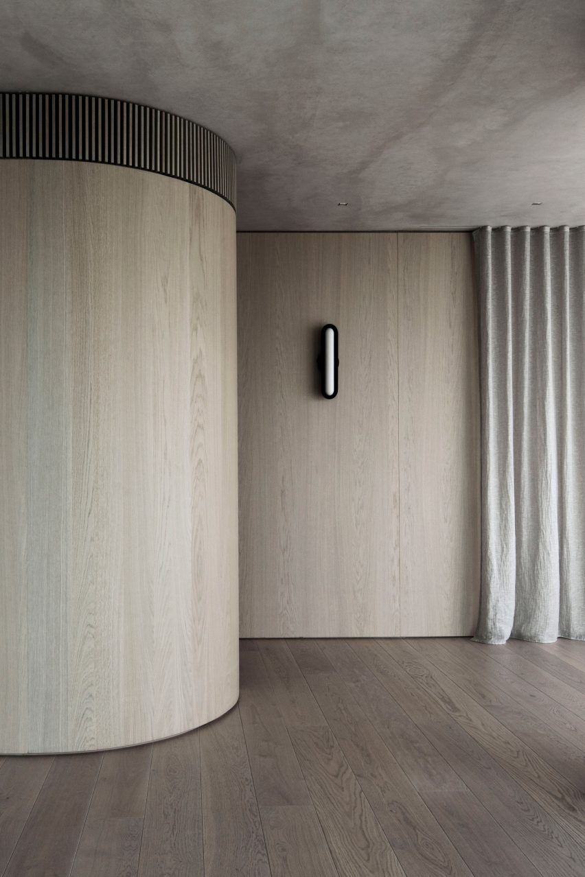 The Melburnian Apartment by Edition Office features oak storage volumes