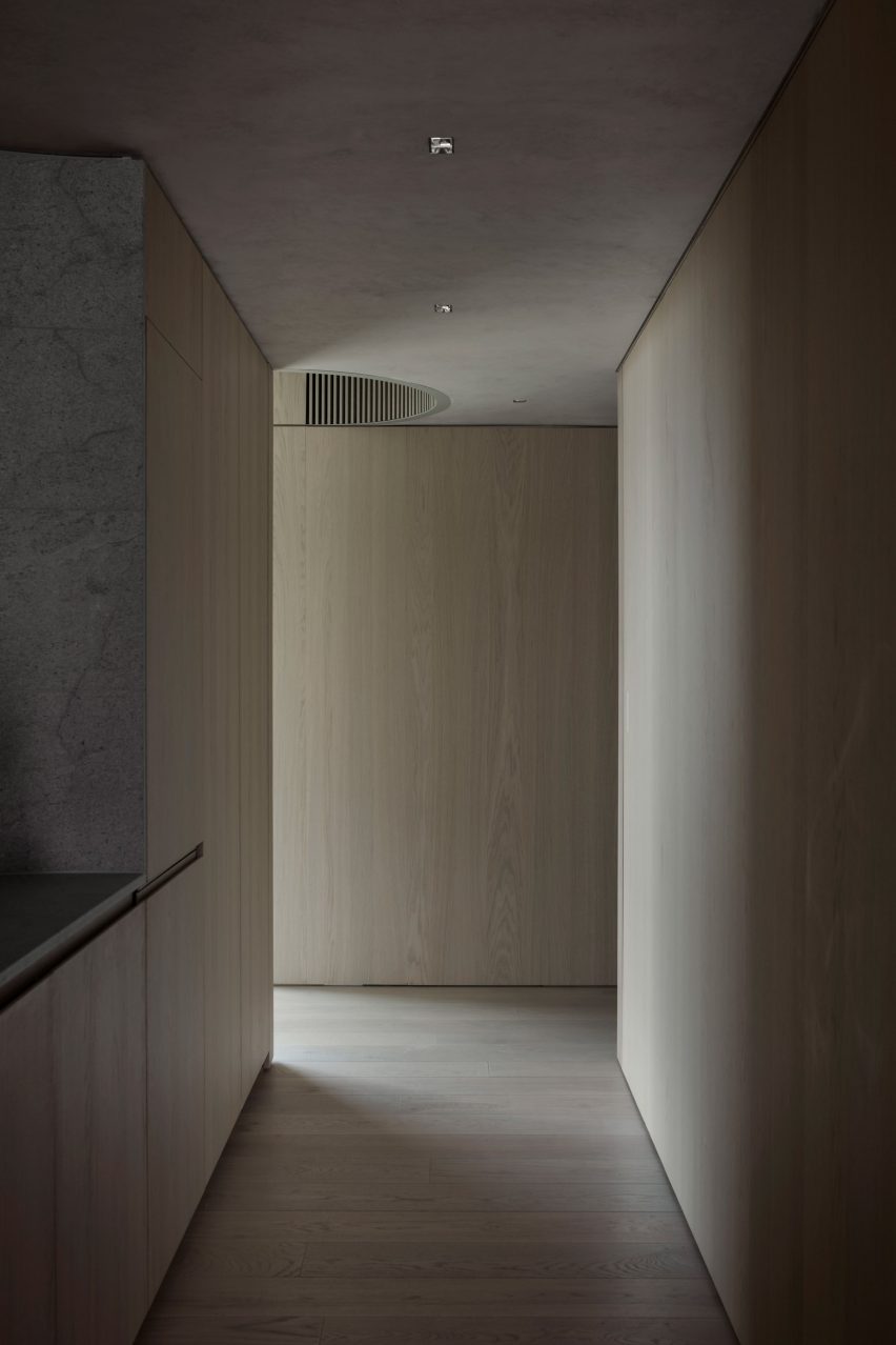 The Melburnian Apartment by Edition Office features oak storage volumes