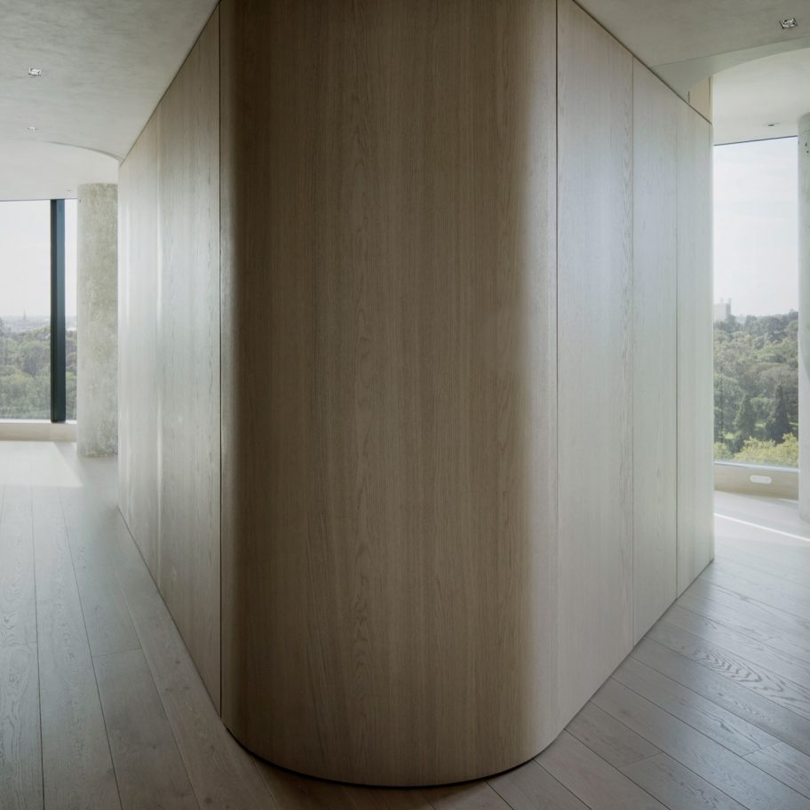 The Melburnian Apartment by Edition Office features oak storage volumes
