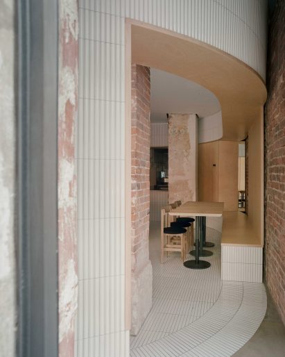 White tiles cover dining area of Papi restaurant in Paris