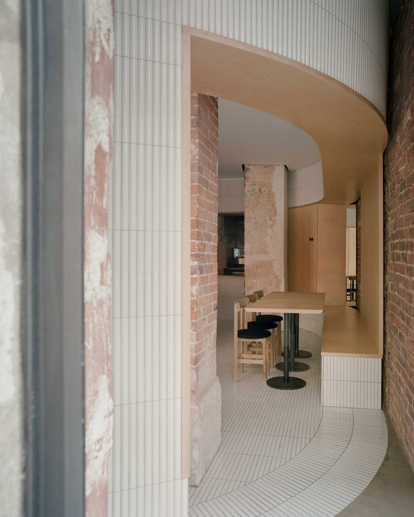 White tiles cover dining area of Papi restaurant in Paris
