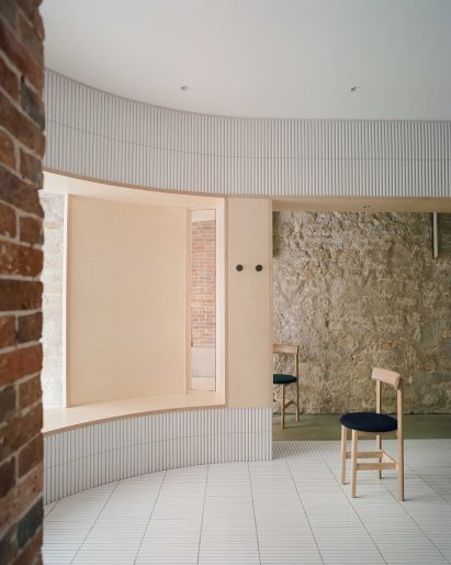 White tiles cover dining area of Papi restaurant in Paris