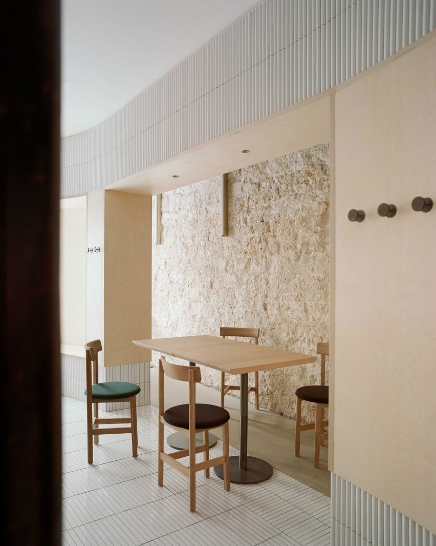 Exposed limestone walls feature inside Papi restaurant in Paris