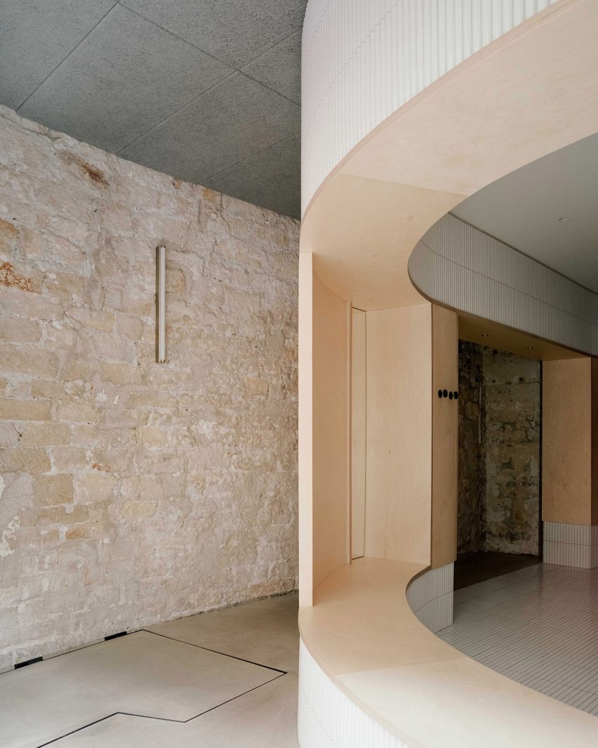 Exposed limestone walls feature inside Papi restaurant in Paris