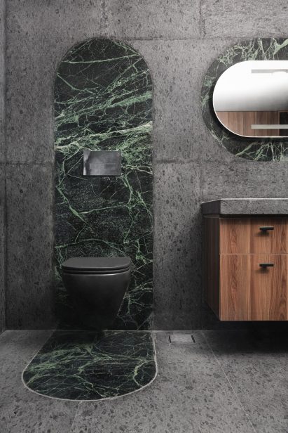 Emerald-coloured marble toilet surround