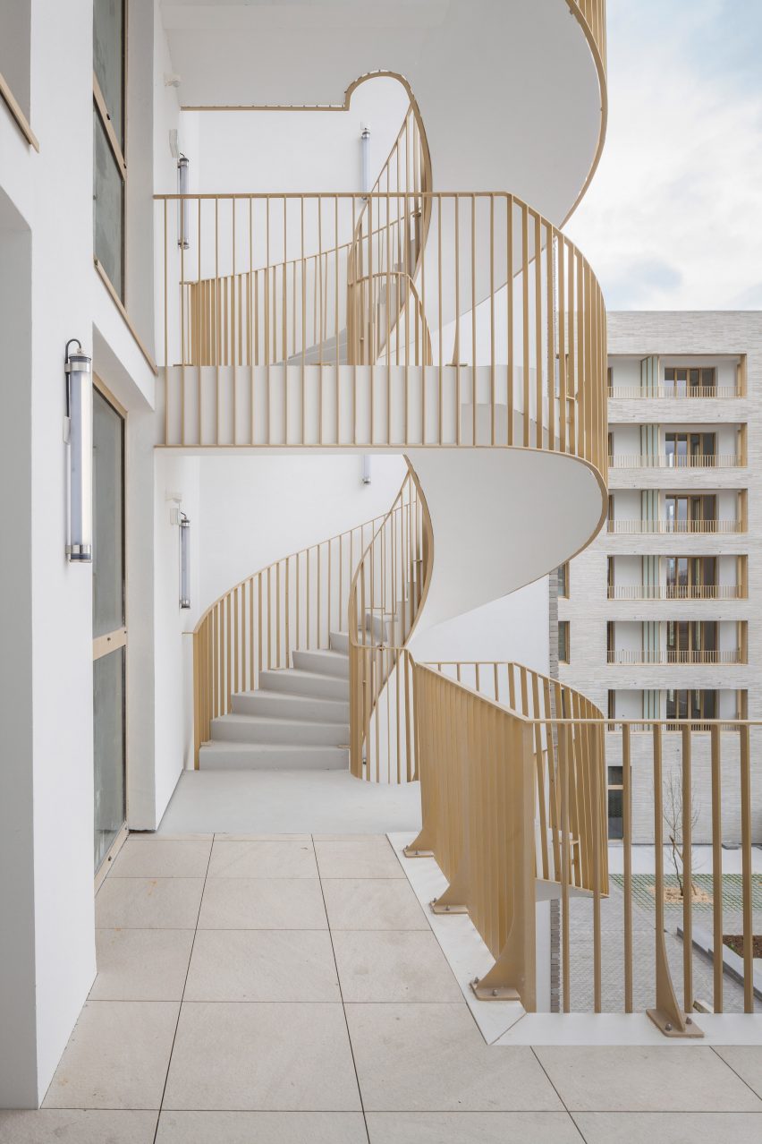 Spiral staircase of Zellige housing in Nantes, France, by Tectône and Tact Architectes