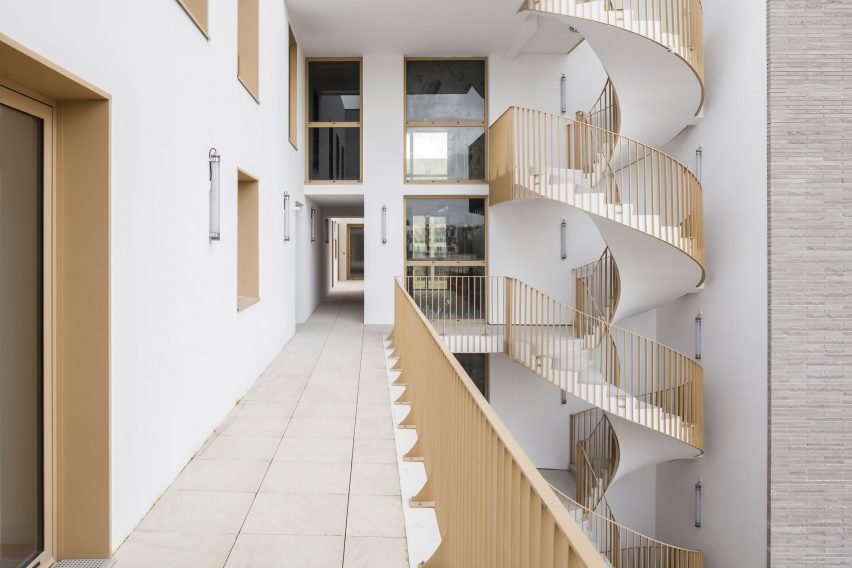 Spiral staircase of Zellige housing in Nantes, France, by Tectône and Tact Architectes
