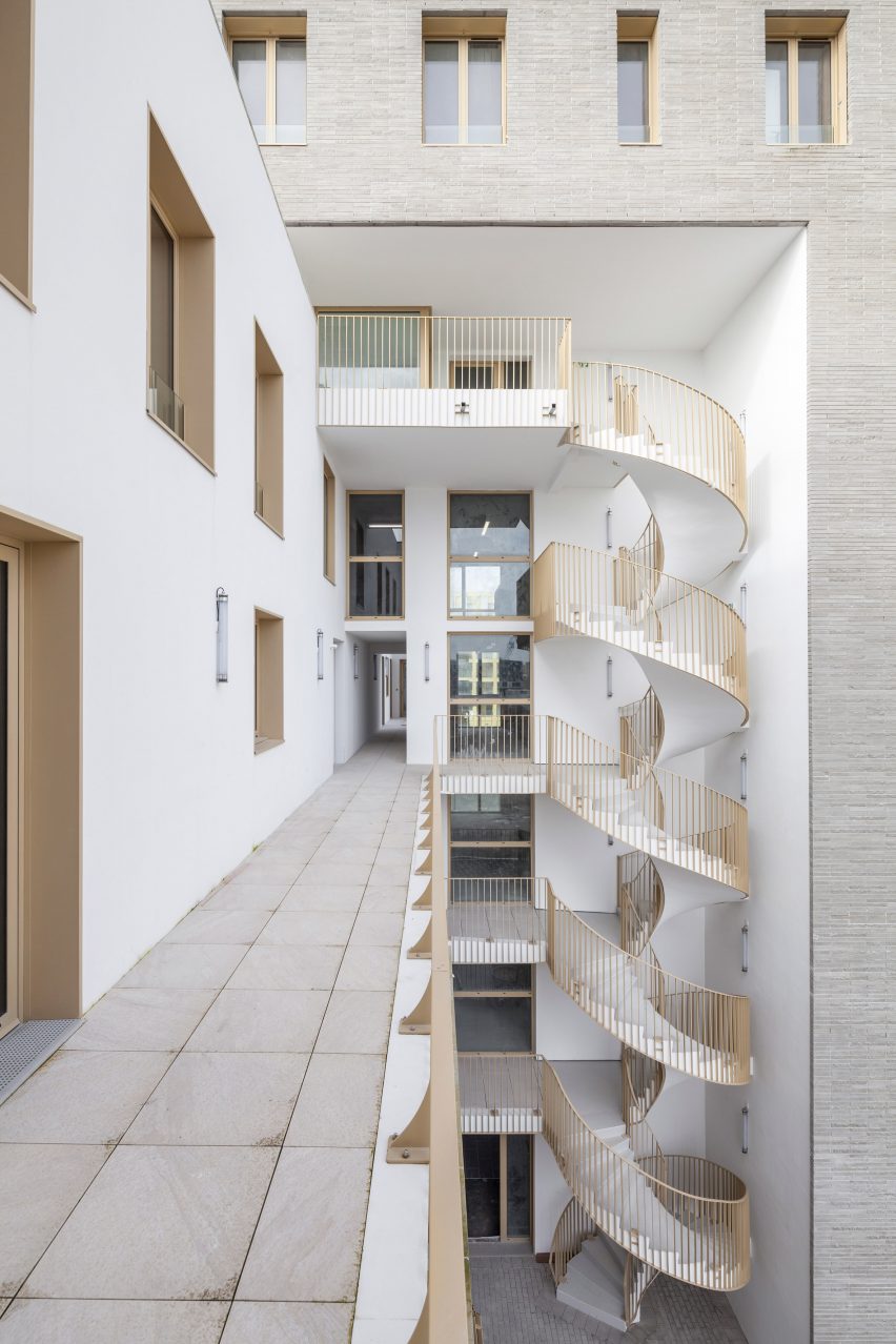 Spiral staircase of Zellige housing in Nantes, France, by Tectône and Tact Architectes