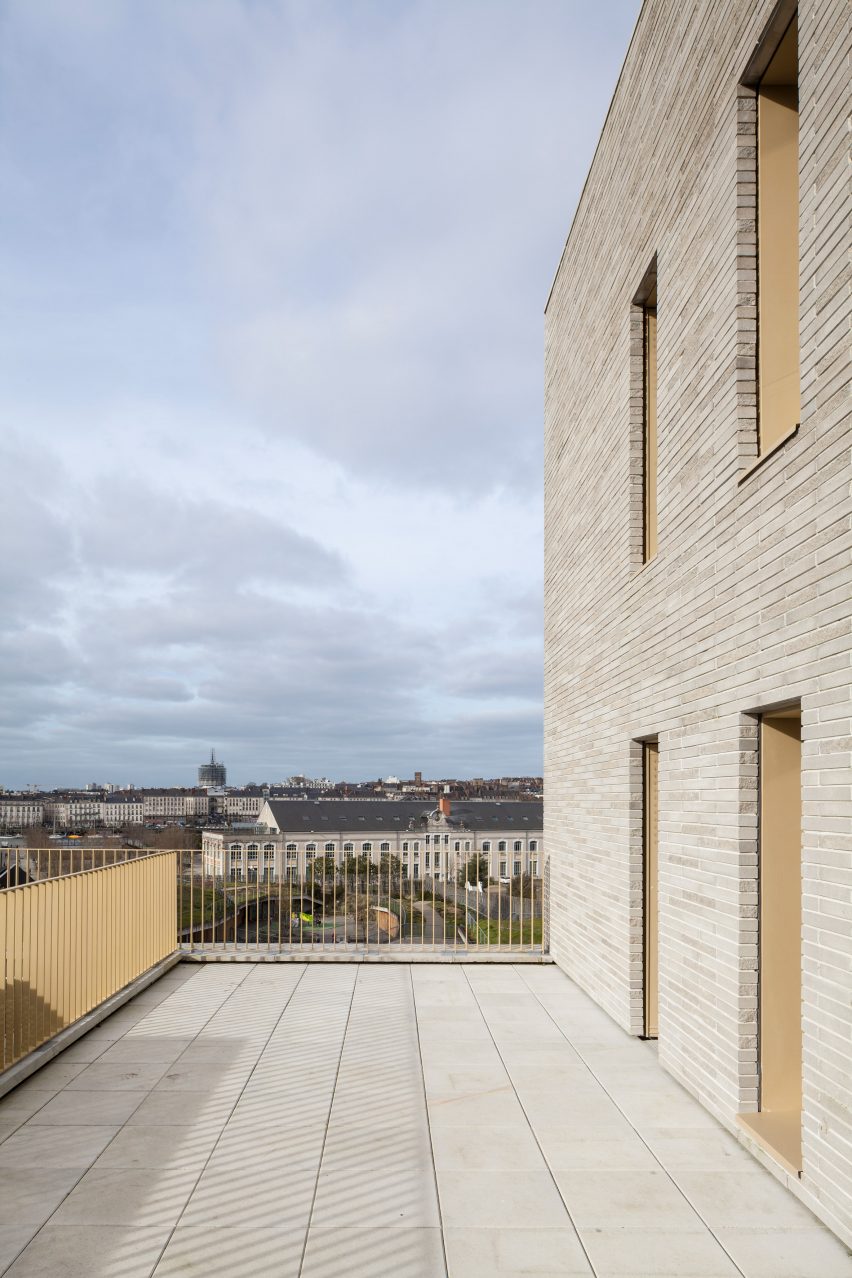Brick facade of Zellige housing in Nantes, France, by Tectône and Tact Architectes