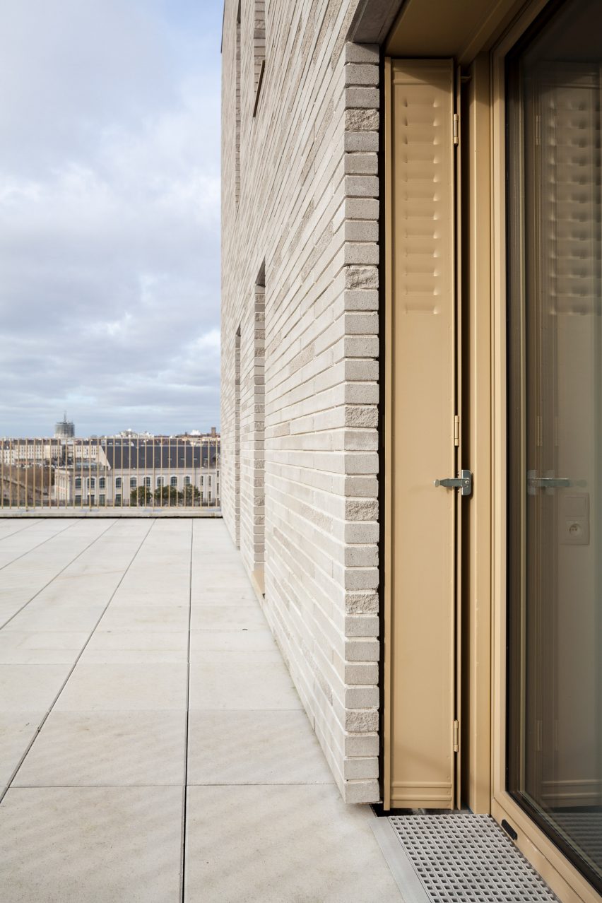 Brick facade of Zellige housing in Nantes, France, by Tectône and Tact Architectes