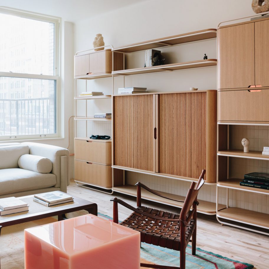 Living room with wooden furniture and resin stool