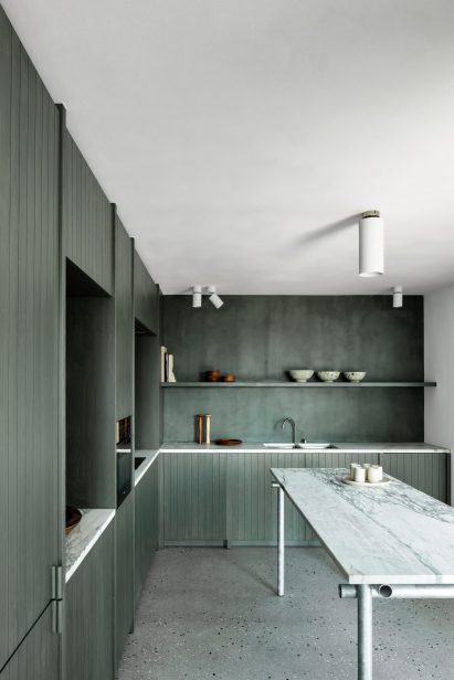 Seaweed green kitchen with marble and steel island