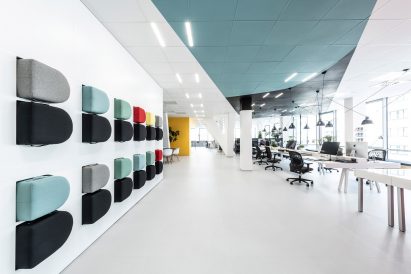 Benches slotted into the wall of the office for creative agency DDB Prague by B2 Architecture, Czech Republic