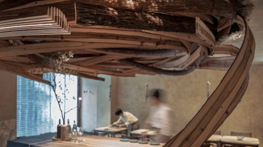 Interior of Embers restaurant in Taipei has nest-like sculpture made from cedar wood
