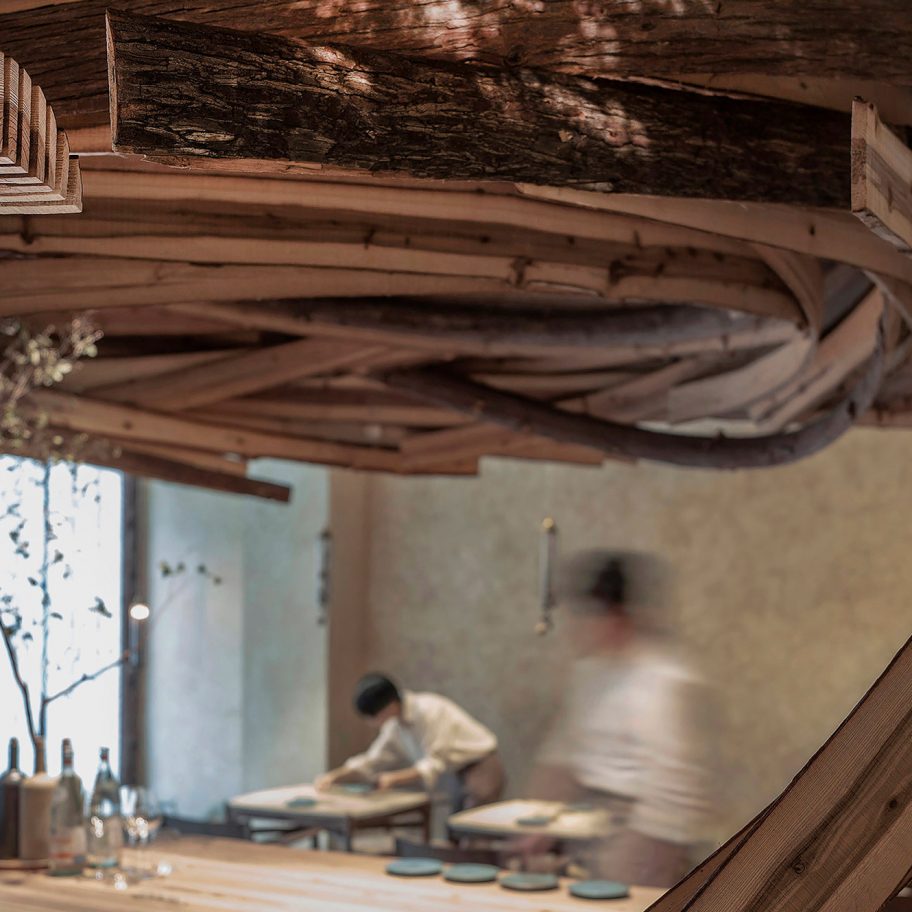Interior of Embers restaurant in Taipei has nest-like sculpture made from cedar wood