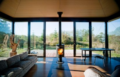 Fireplace inside False Bay Writer's Cabin by Olson Kundig
