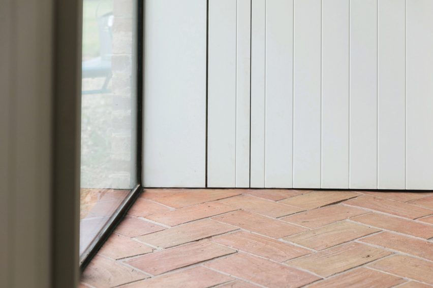 Terracotta flooring in Farley Farmhouse by Emil Eve Architects