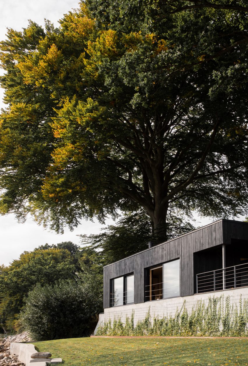Fjord Boat House by Norm Architects features black-timber facade