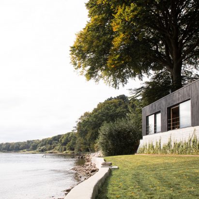 Fjord Boat House by Norm Architects features black-timber facade