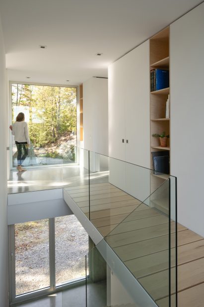 Staircase and catwalk in Bedroom in Forest House I by Natalie Dionne Architecture